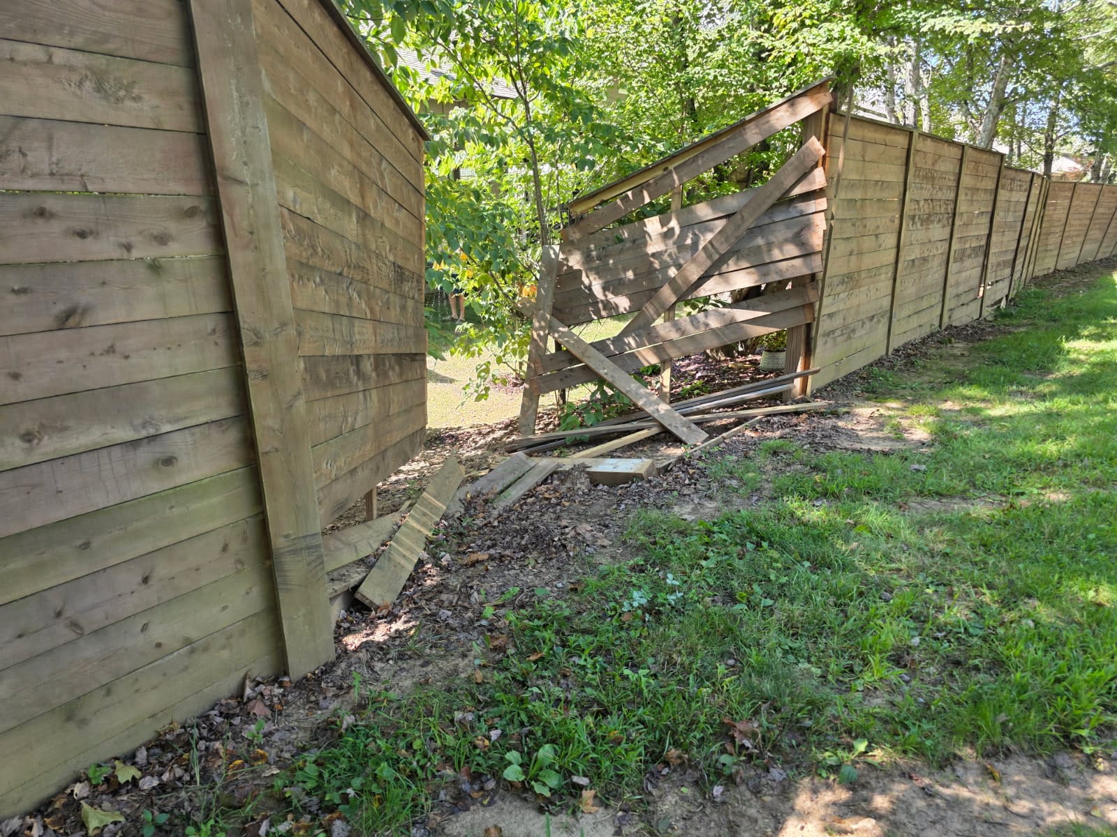broken fence before WNC Fencing Company repaired it